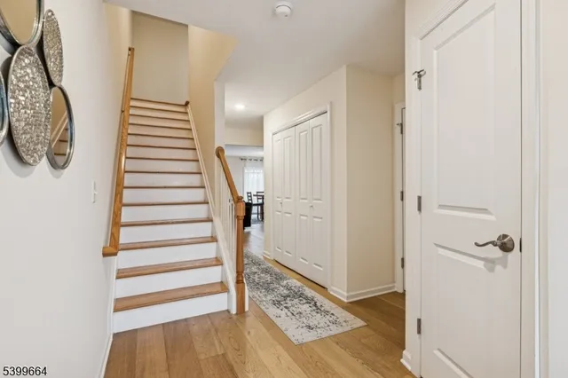 a view of entryway with stairs and wooden floor