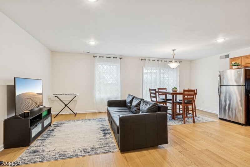 18 Joseph Drive, Unit 18 Newton, NJ 07860 - Photo 6 of 24 a living room with furniture and a wooden floor
