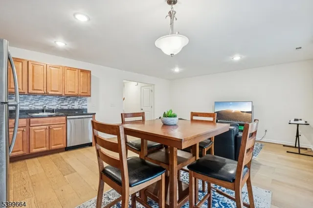 a kitchen with a table and chairs in it