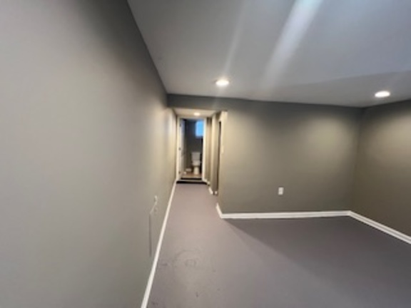 14918 Evers Street Dolton, IL 60419 - Photo 22 of 29 an empty room with wooden floor and windows