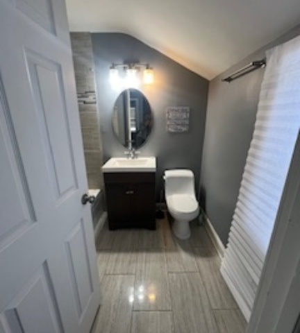 14918 Evers Street Dolton, IL 60419 - Photo 8 of 29 a bathroom with a toilet sink and mirror