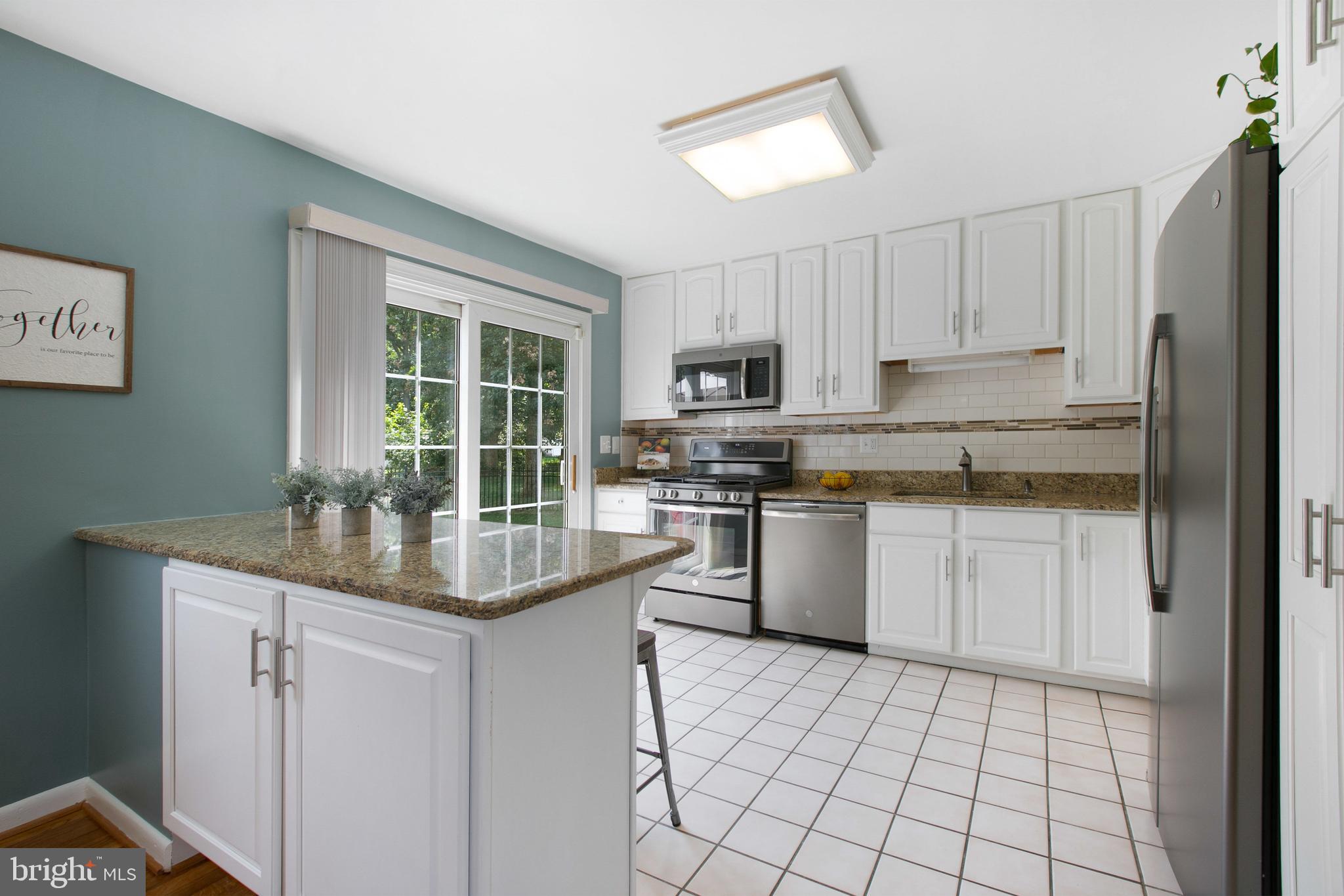 500 Crosby Road Baltimore, MD 21228 - Photo 11 of 41 Granite countertops & custom tile backsplash
