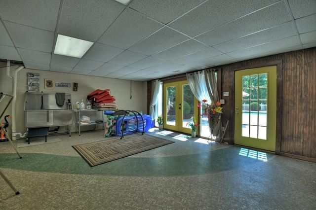 a spacious bedroom with a bed and a cabinets