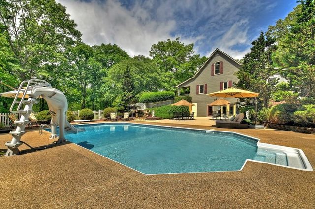 a view of a house with pool yard and outdoor space