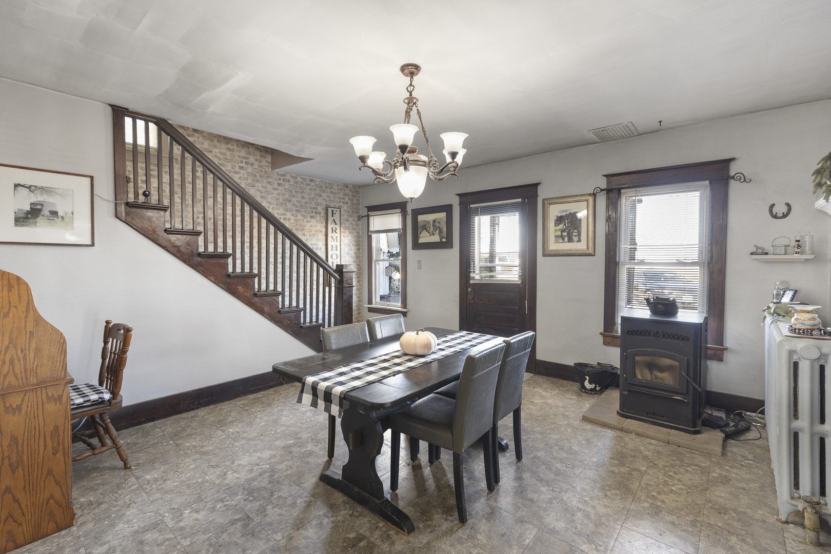 1624 East 1200 North Road Milford, IL 60953 - Photo 14 of 45 a view of a dining room with furniture and a chandelier