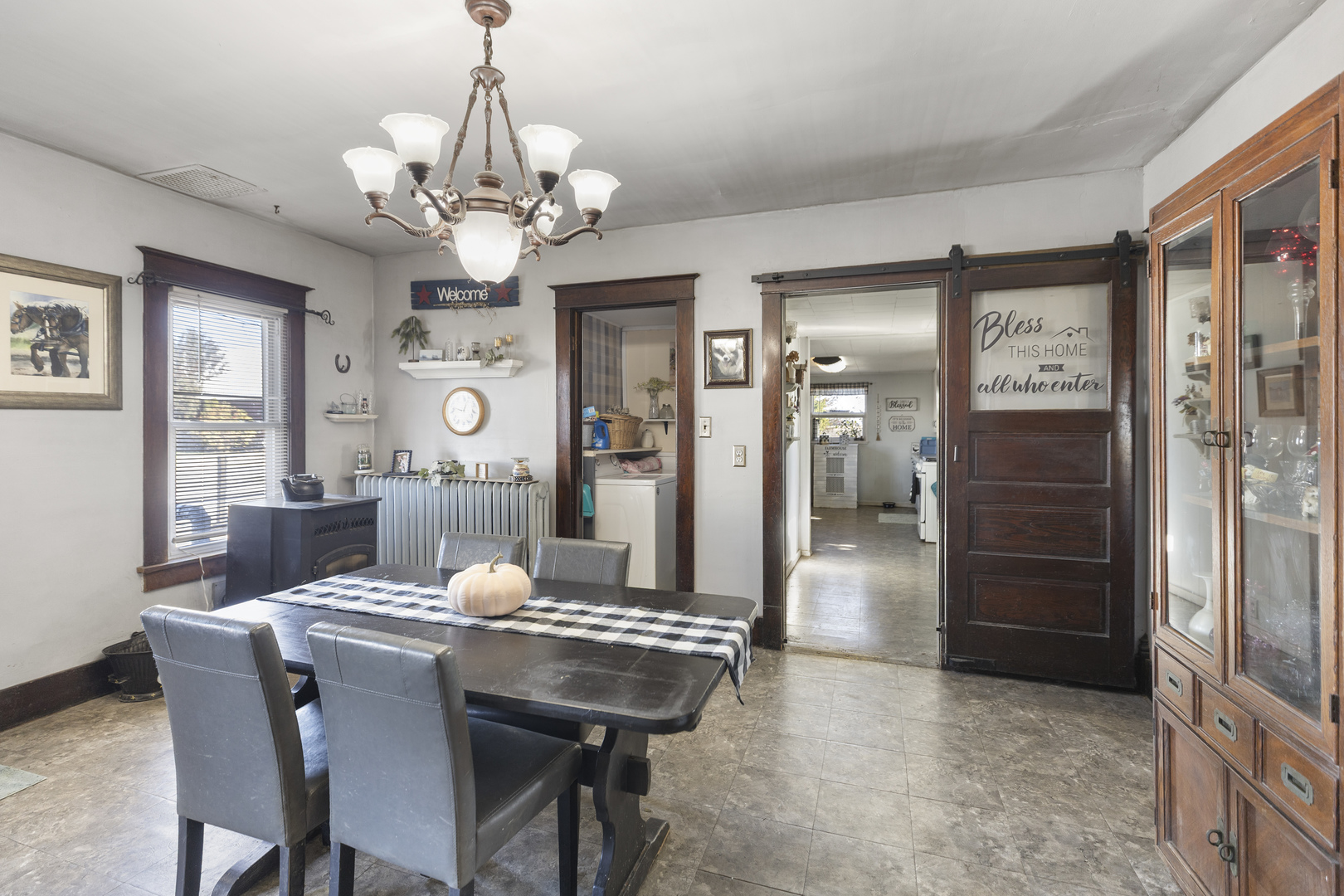 1624 East 1200 North Road Milford, IL 60953 - Photo 15 of 45 a view of a dining room with furniture and a chandelier