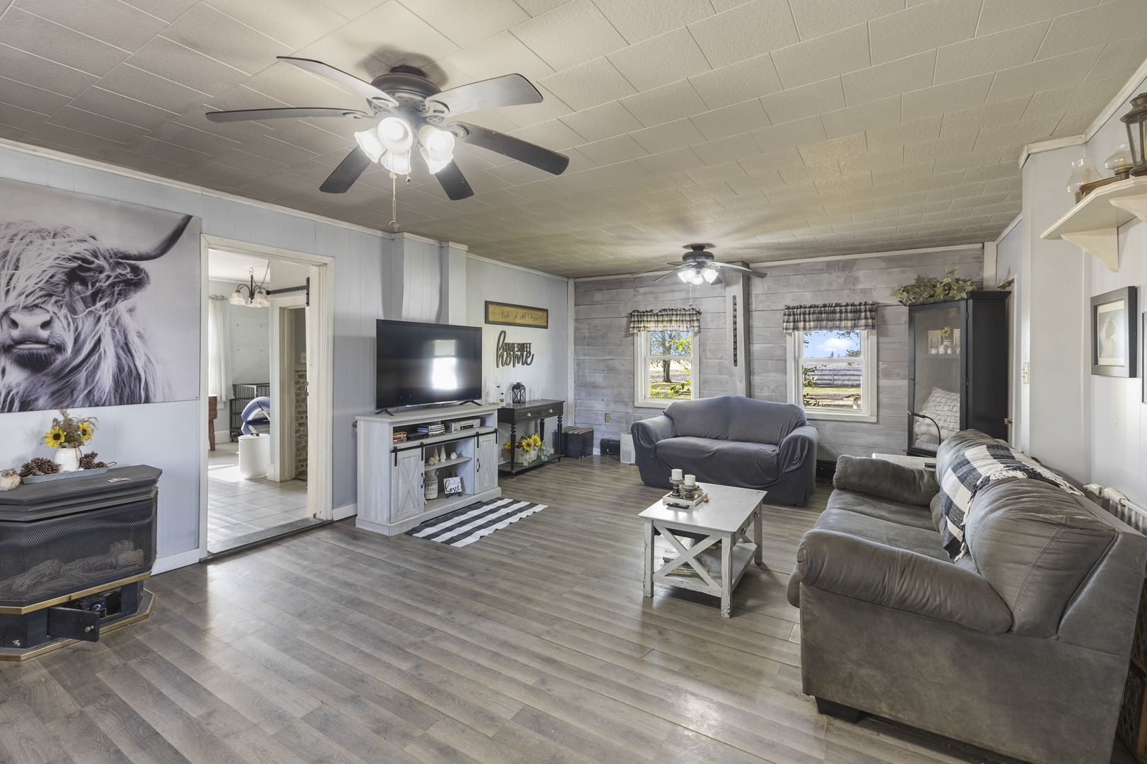 1624 East 1200 North Road Milford, IL 60953 - Photo 18 of 45 a living room with furniture and a flat screen tv