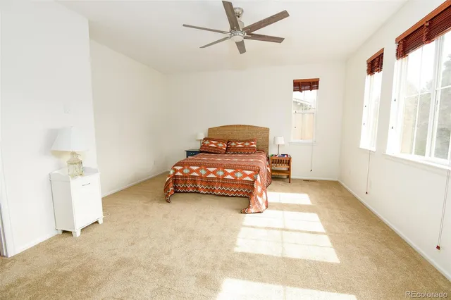 a spacious bathroom with a tub sink and mirror