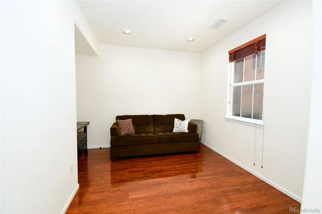 a bathroom with a sink a toilet a mirror a vanity and shower