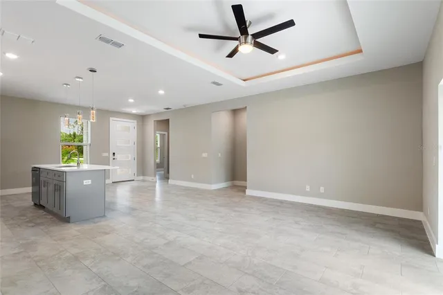 a kitchen with stainless steel appliances a refrigerator and a stove top oven