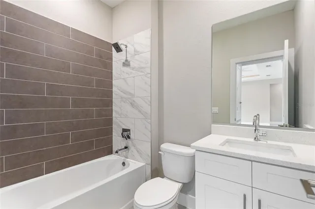 an empty room with closet and a chandelier fan