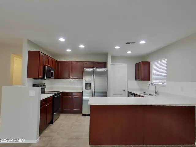 a view of a kitchen with furniture and window