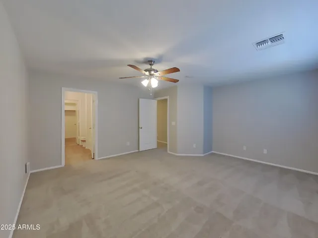 a kitchen with refrigerator and microwave