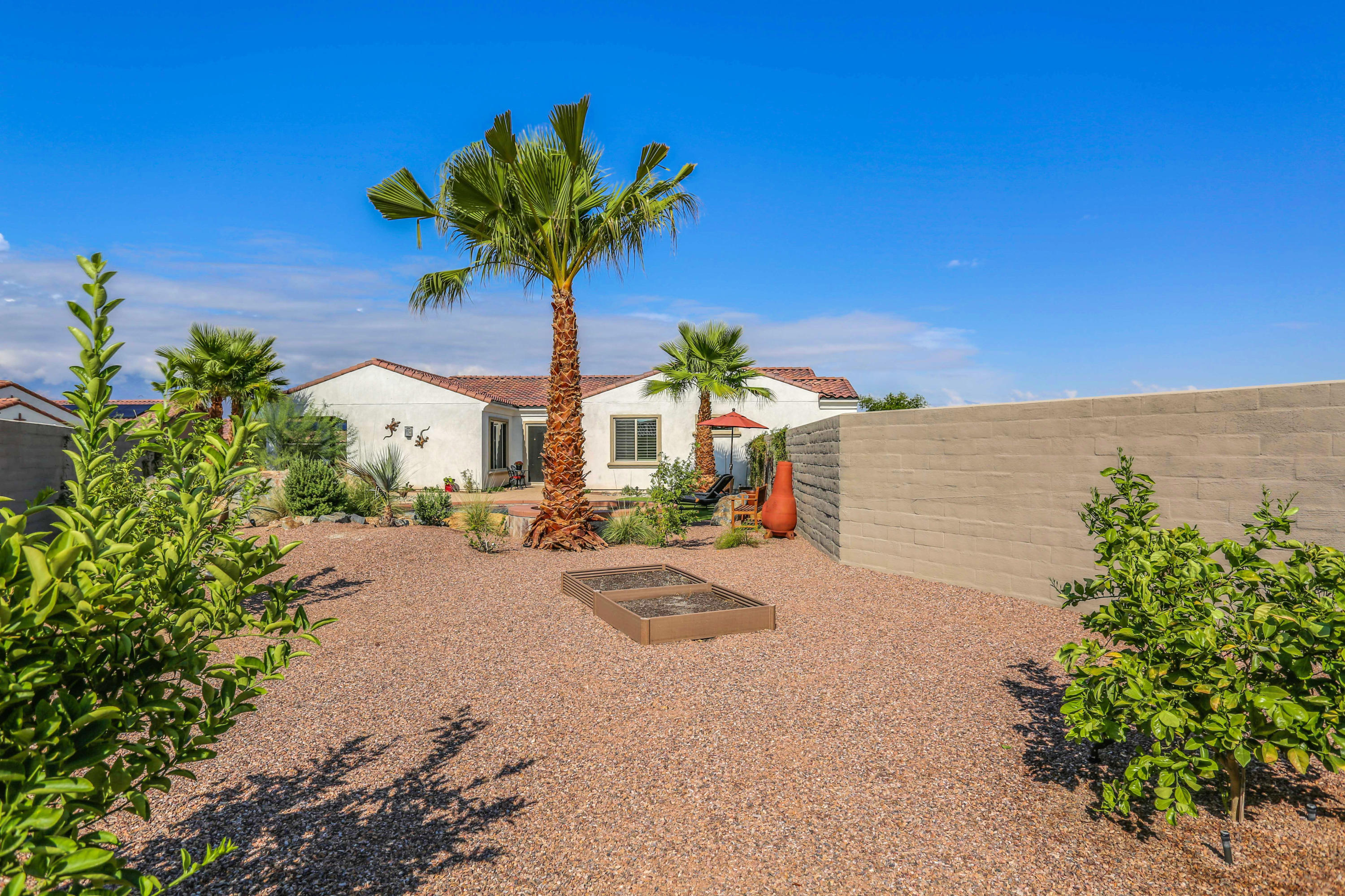 23 Pinotage Rancho Mirage, CA 92270 - Photo 22 of 38 a view of a porch with potted plants