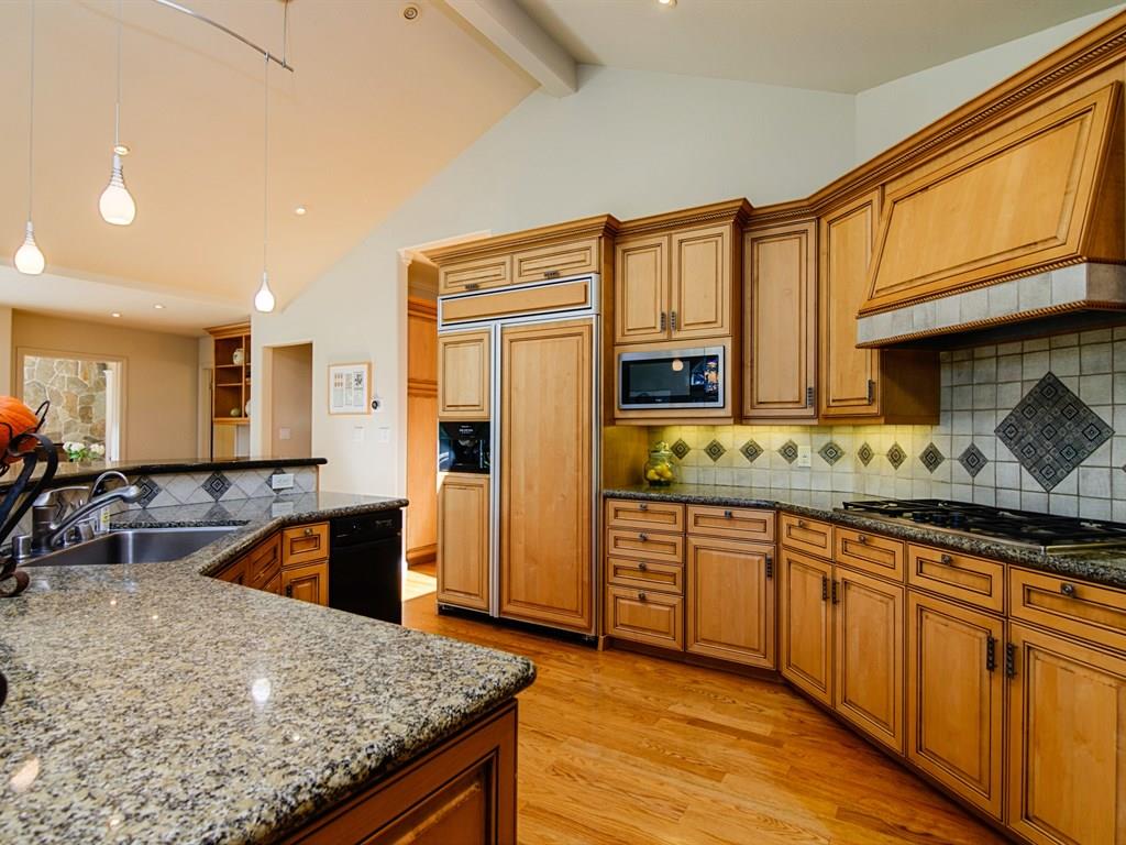 714 Arroyo Road Los Altos, CA 94024 - Photo 11 of 29 a kitchen with stainless steel appliances granite countertop a sink stove and refrigerator