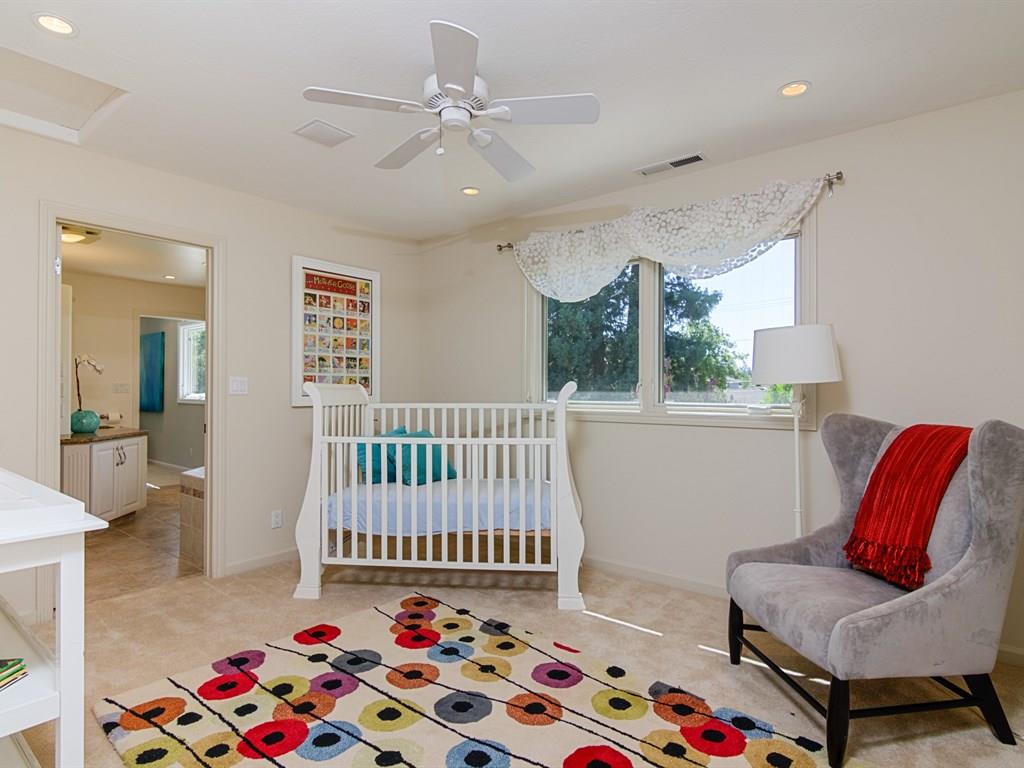 714 Arroyo Road Los Altos, CA 94024 - Photo 23 of 29 a bedroom with furniture and a rug