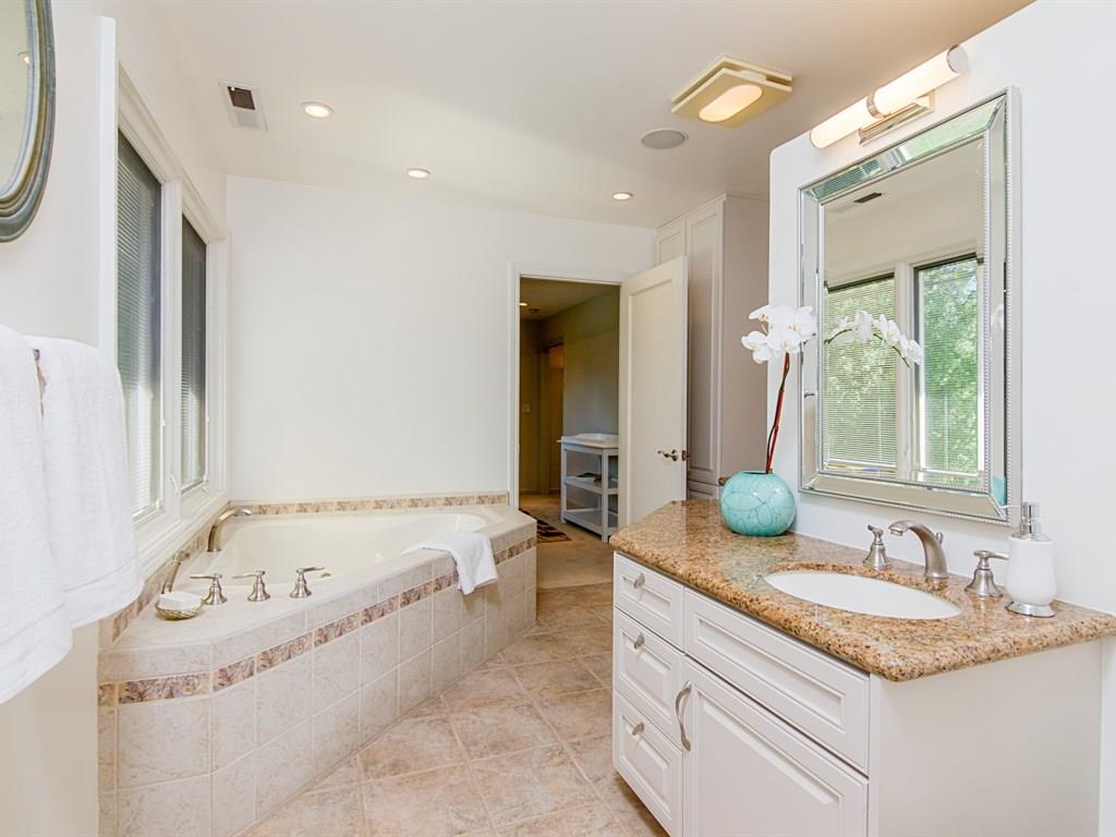 714 Arroyo Road Los Altos, CA 94024 - Photo 26 of 29 a bathroom with a granite countertop tub and a sink