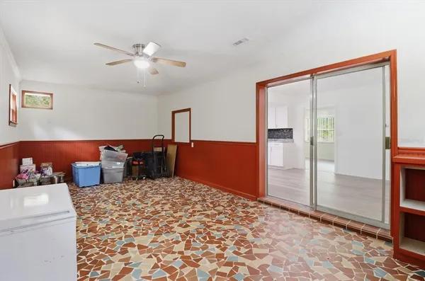 a view of room with stairs and wooden floor