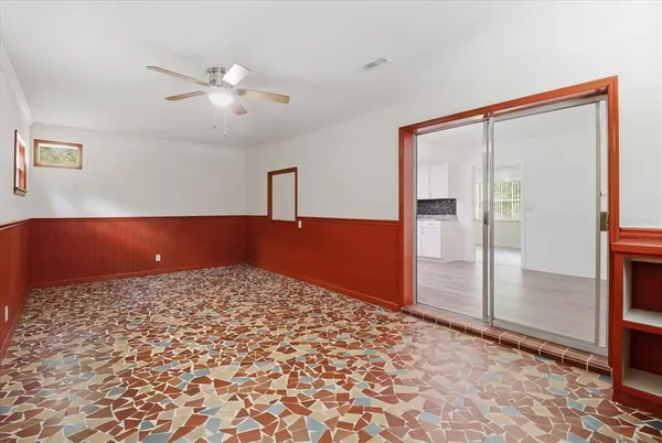 a view of a room with wooden floor