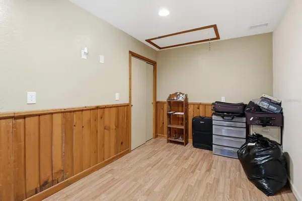 a bedroom with a workspace