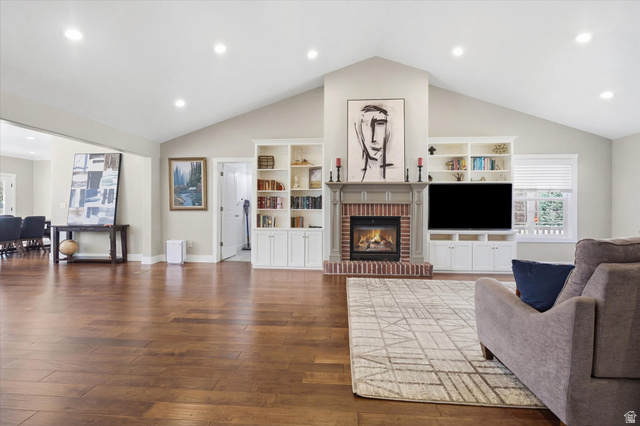 353 Robin Street Smithfield, UT 84335 - Photo 13 of 70 Living area with dark wood-style floors, recessed lighting, and a brick fireplace