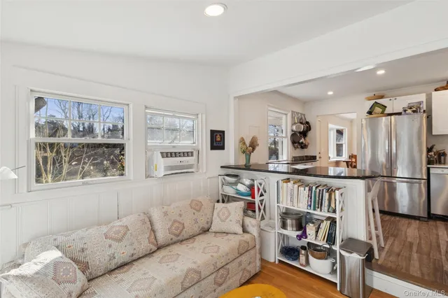 a living room with furniture and a window