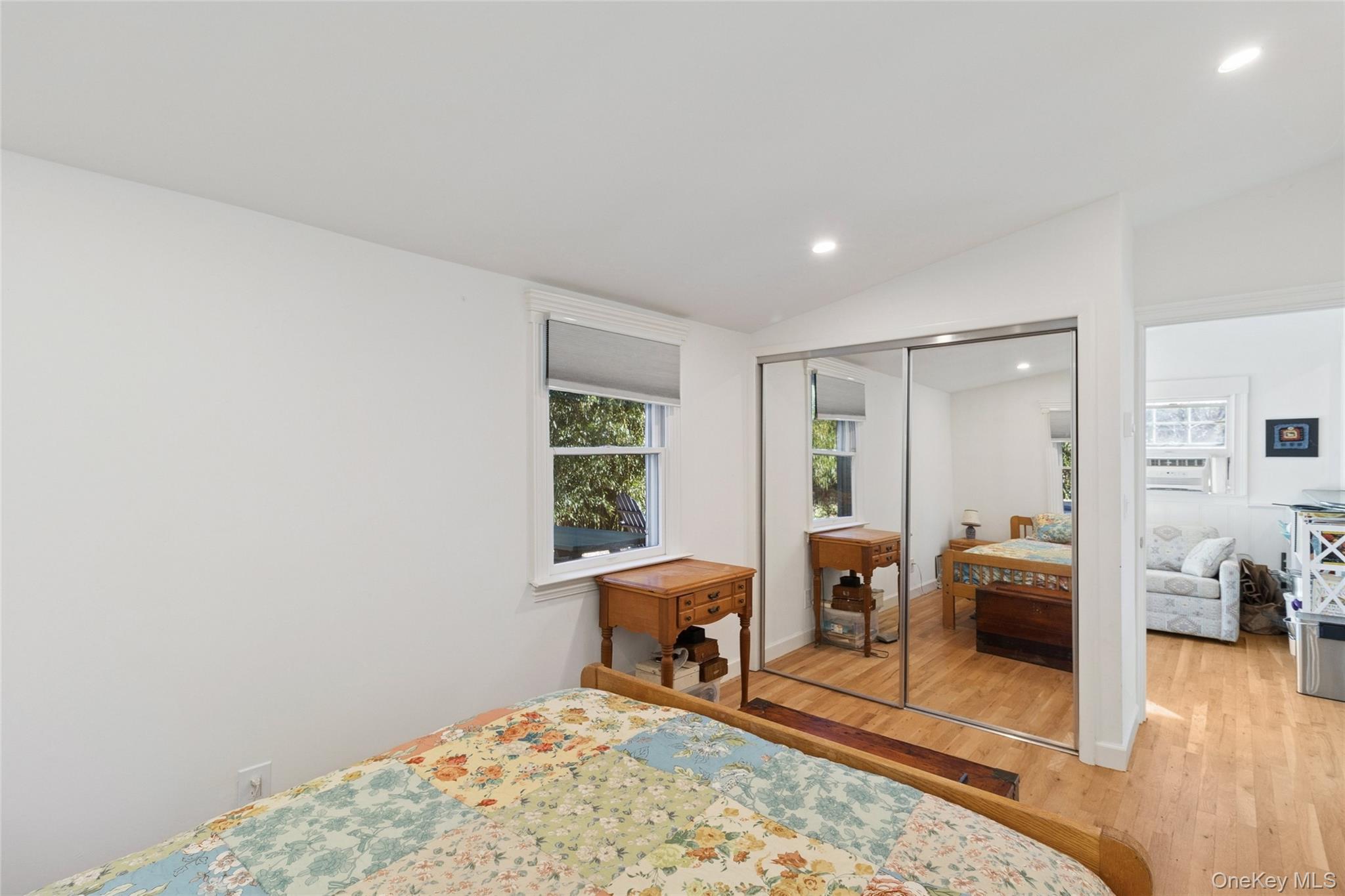 165 Springville Road, Unit A Hampton Bays, NY 11946 - Photo 15 of 22 Bedroom with recessed lighting, light wood-type flooring, lofted ceiling, and a closet