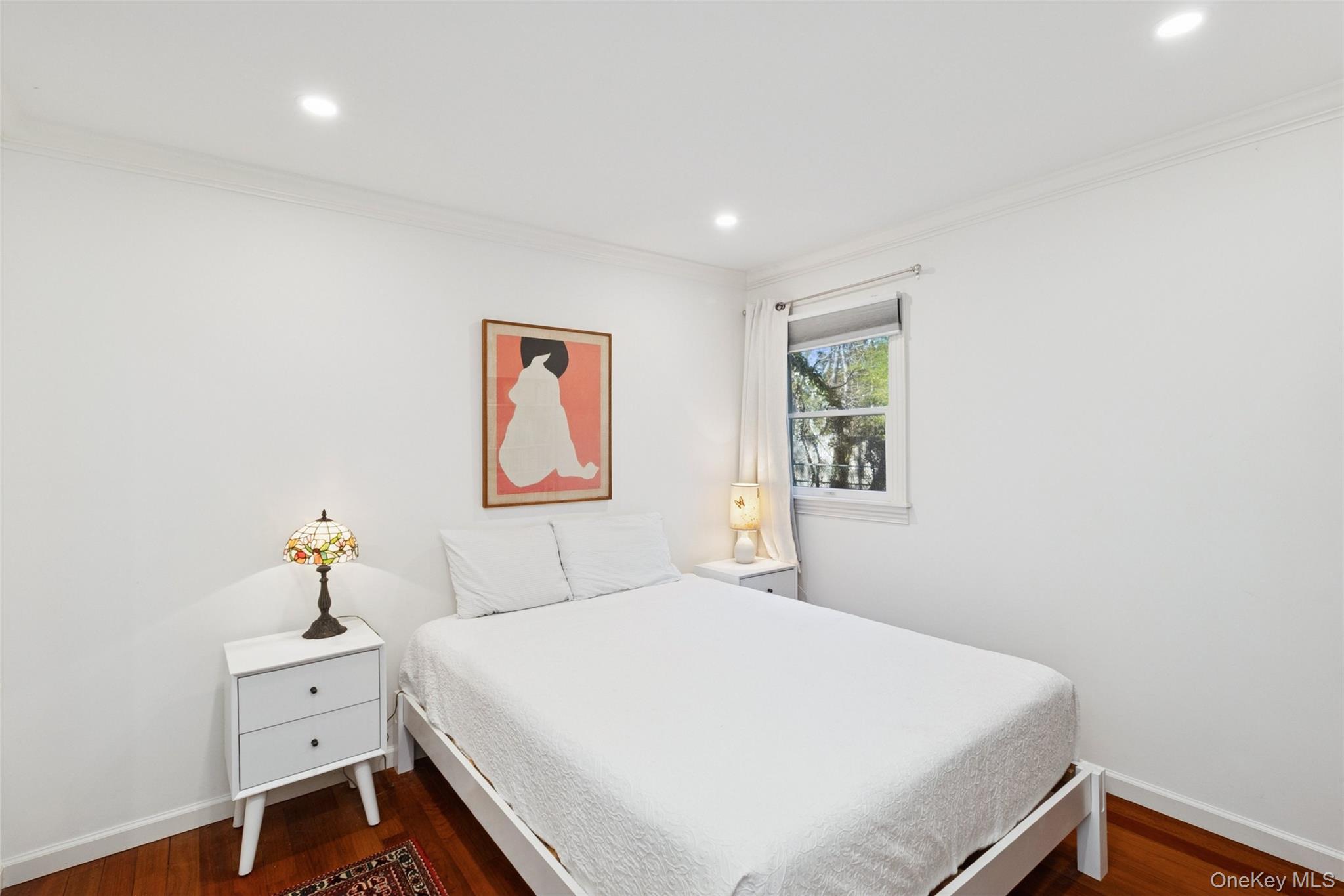 165 Springville Road, Unit A Hampton Bays, NY 11946 - Photo 17 of 22 Bedroom featuring dark wood finished floors, recessed lighting, and crown molding