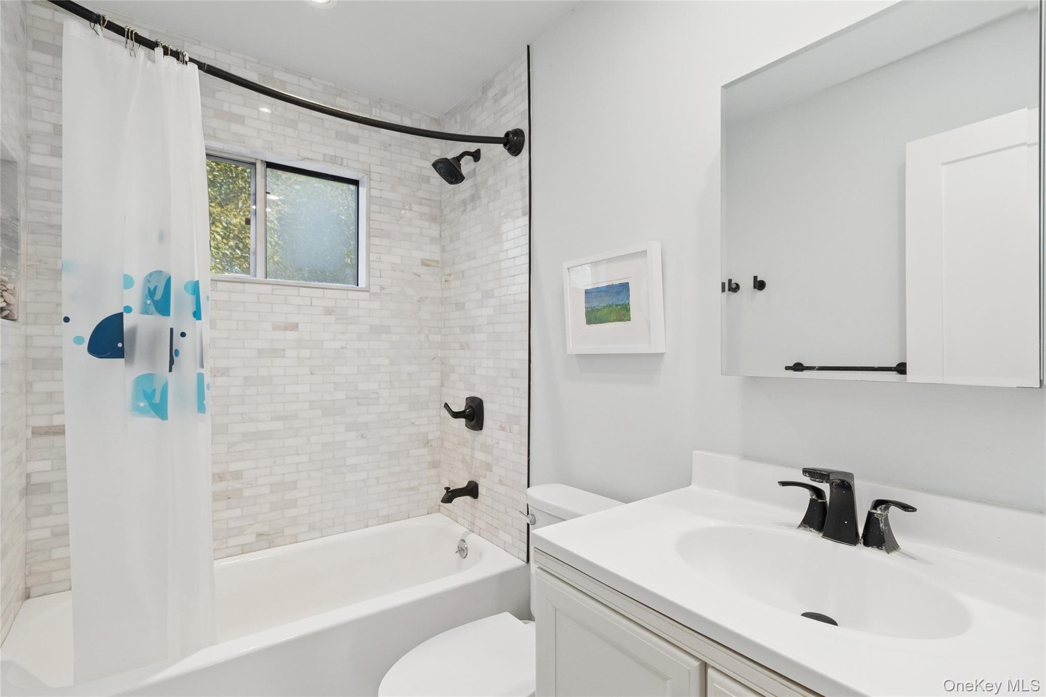 165 Springville Road, Unit A Hampton Bays, NY 11946 - Photo 18 of 22 Full bath with shower / bathtub combination with curtain and vanity