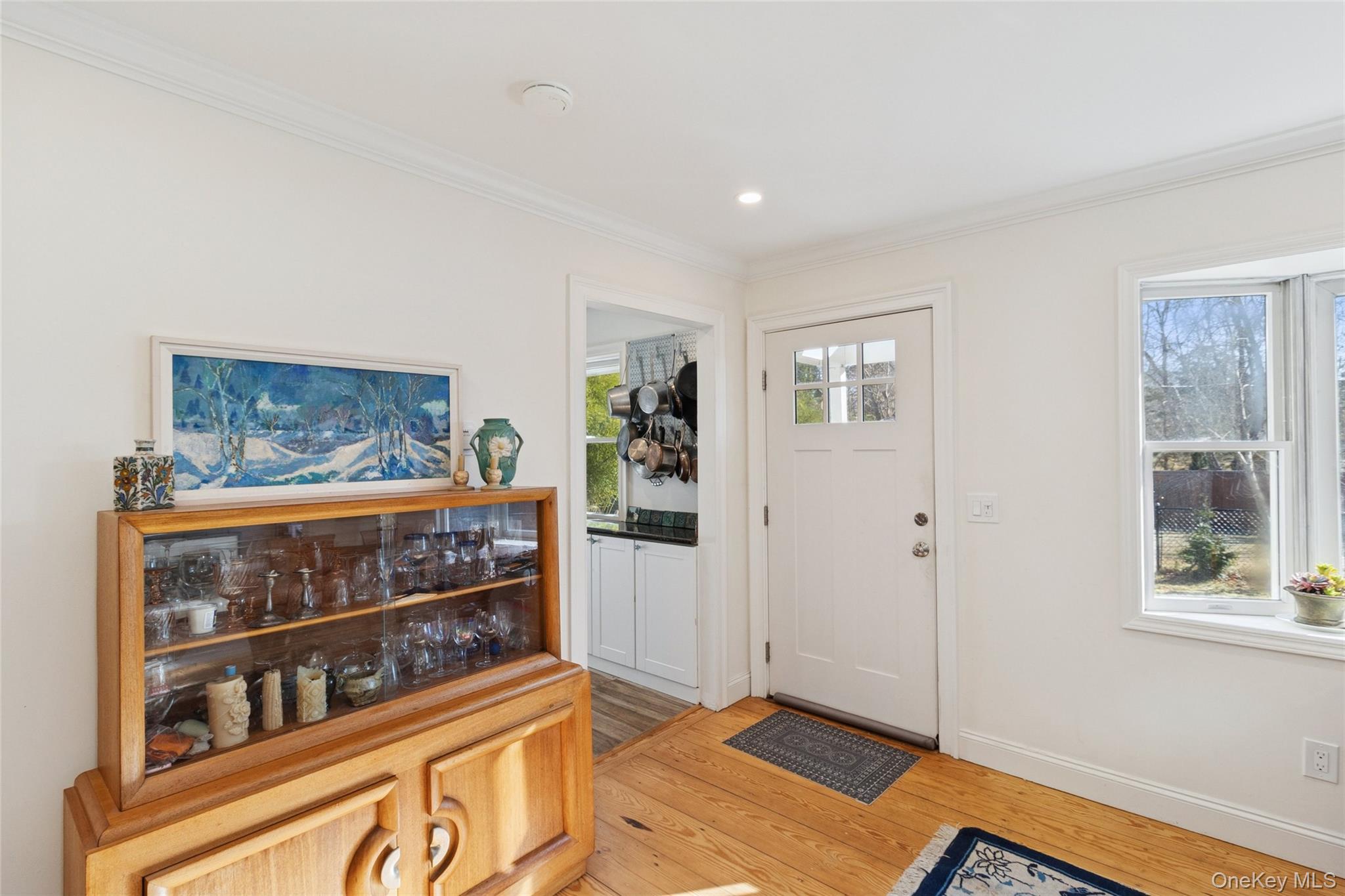 165 Springville Road, Unit A Hampton Bays, NY 11946 - Photo 5 of 22 Foyer featuring light wood-style flooring, crown molding, and recessed lighting