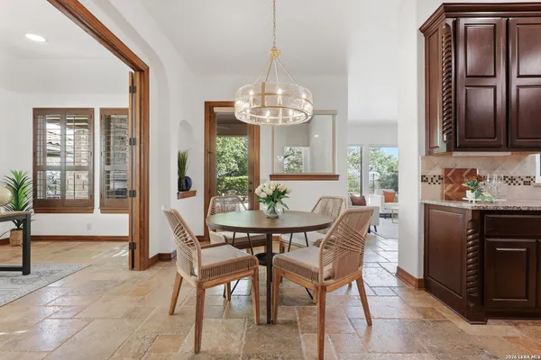 a view of a dining room with furniture window and outside view