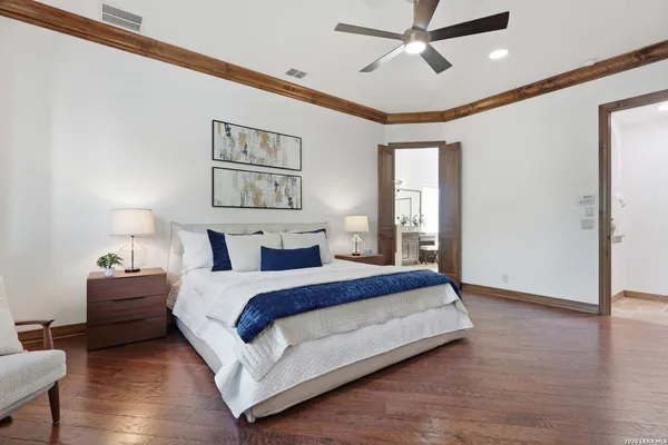 a bathroom with a granite countertop tub sink a mirror a vanity and a shower