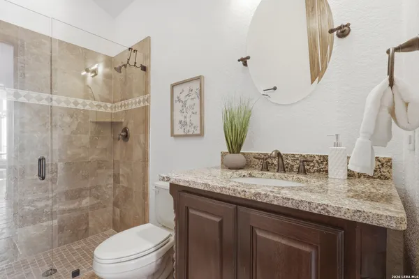 a spacious bedroom with a bed and a large window