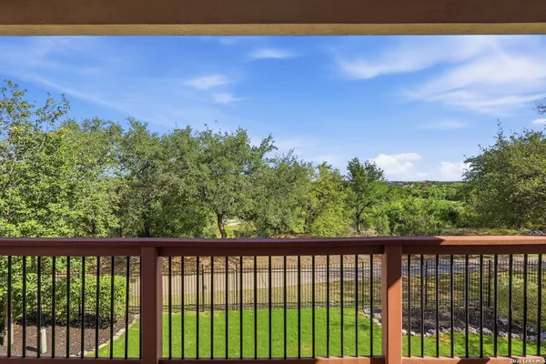 a bathroom with a granite countertop sink a mirror and a vanity