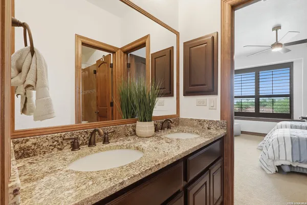 a living room with patio furniture and a fireplace