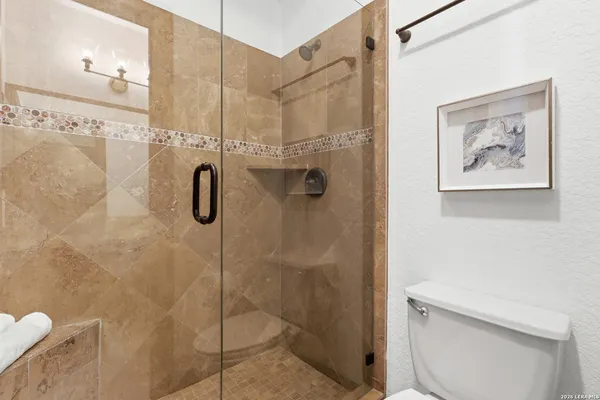 a living room with furniture a fireplace and a table