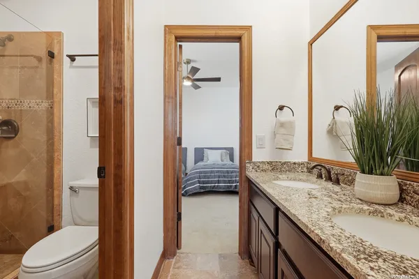 a view of a house with backyard and sitting area