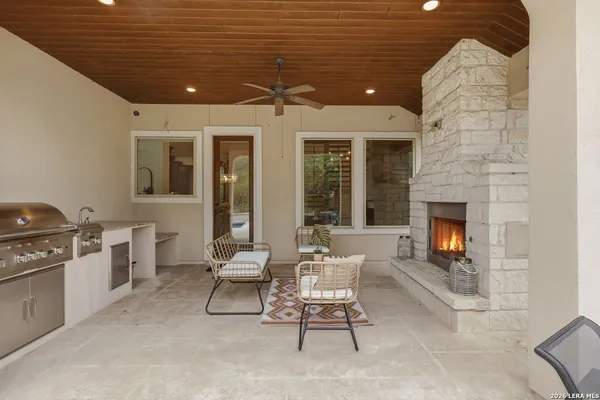 an aerial view of a house with a yard and lake view