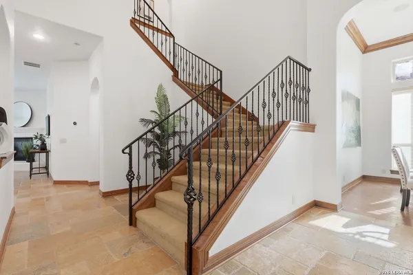a large kitchen with stainless steel appliances lots of counter top space