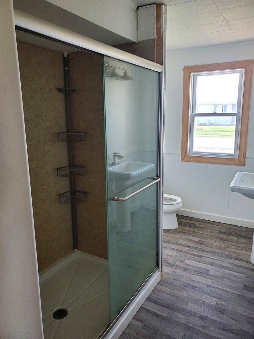 191 East 2740s Road Kankakee, IL 60901 - Photo 7 of 10 a bathroom with a shower a toilet and sink