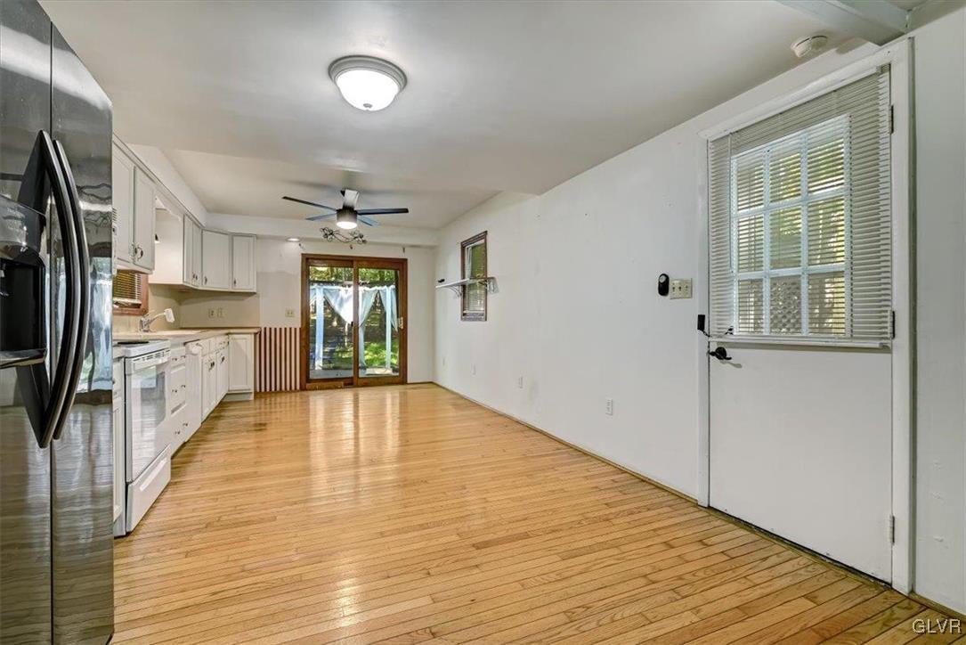 109 Sassafras Road Albrightsville, PA 18210 - Photo 13 of 49 a large kitchen with cabinets wooden floor and stainless steel appliances