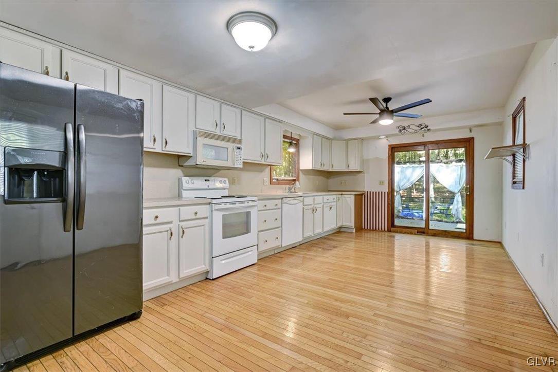 109 Sassafras Road Albrightsville, PA 18210 - Photo 15 of 49 a large kitchen with stainless steel appliances granite countertop a stove a sink dishwasher and a refrigerator