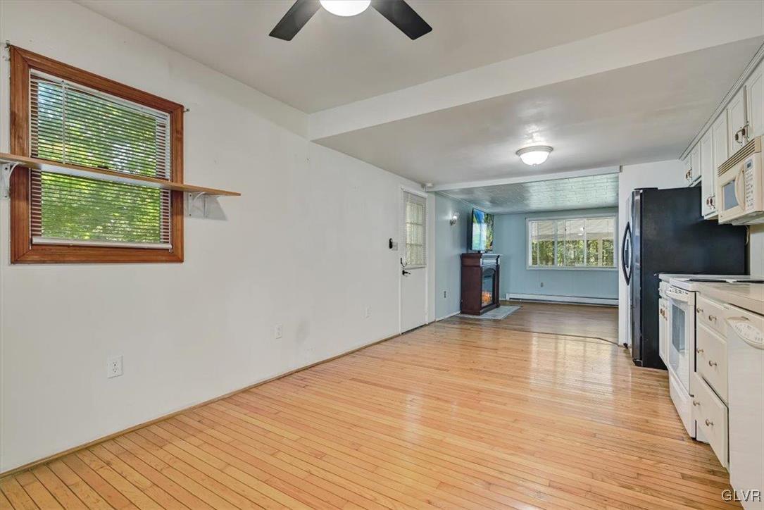 109 Sassafras Road Albrightsville, PA 18210 - Photo 18 of 49 a view of an empty room with a window and wooden floor
