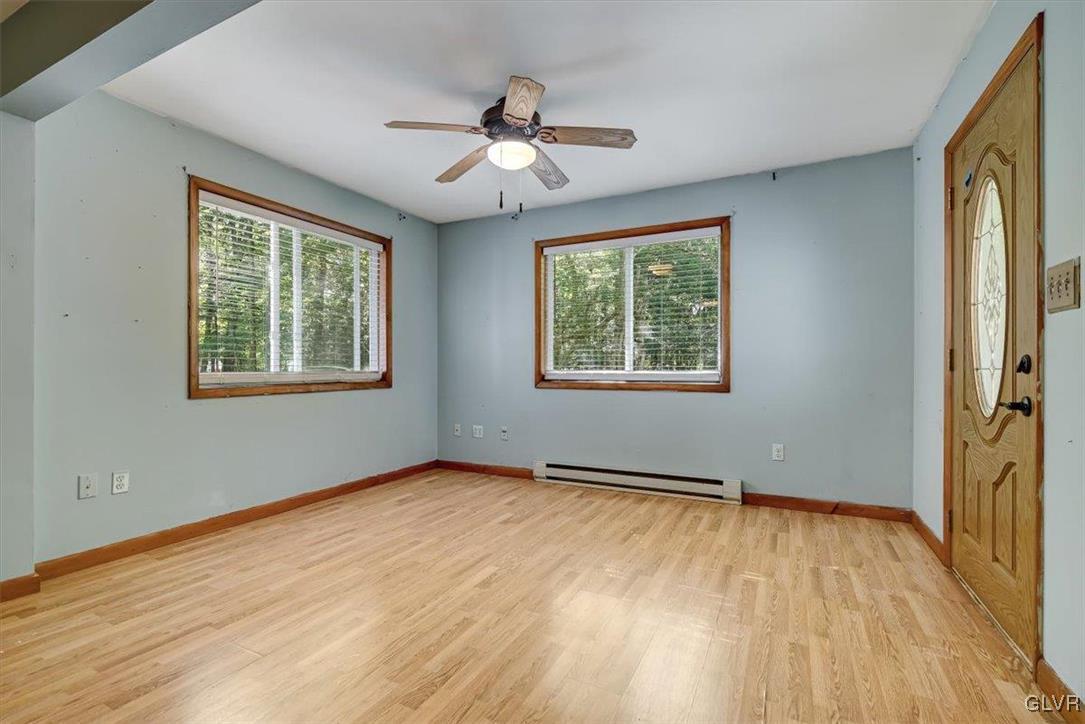 109 Sassafras Road Albrightsville, PA 18210 - Photo 22 of 49 a view of an empty room with wooden floor and a window