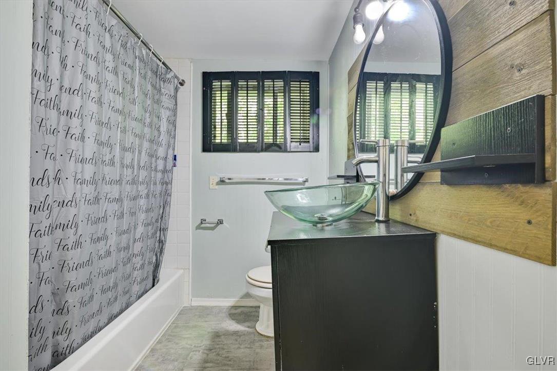 109 Sassafras Road Albrightsville, PA 18210 - Photo 29 of 49 a bathroom with a granite countertop sink a toilet and mirror