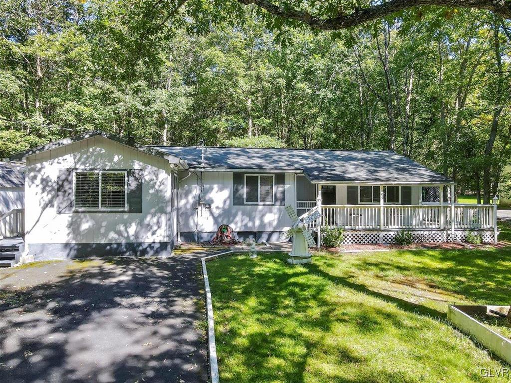 109 Sassafras Road Albrightsville, PA 18210 - Photo 3 of 49 a front view of a house with a yard
