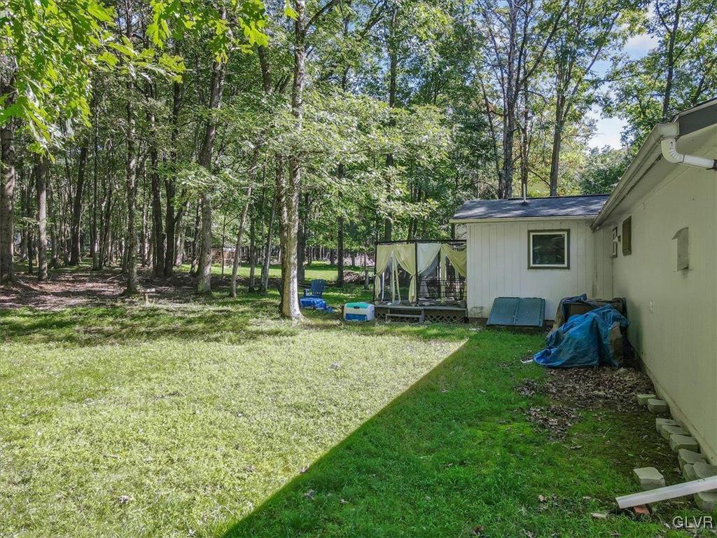 109 Sassafras Road Albrightsville, PA 18210 - Photo 37 of 49 a view of a house with backyard and a tree