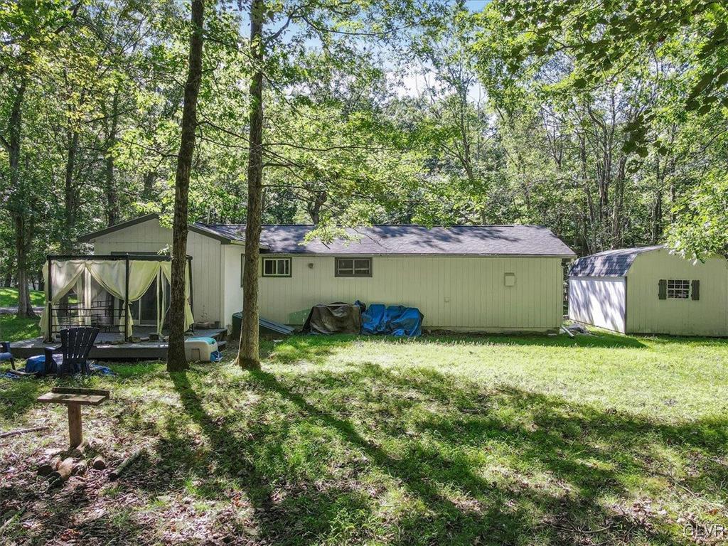 109 Sassafras Road Albrightsville, PA 18210 - Photo 40 of 49 a view of a house with backyard and trees