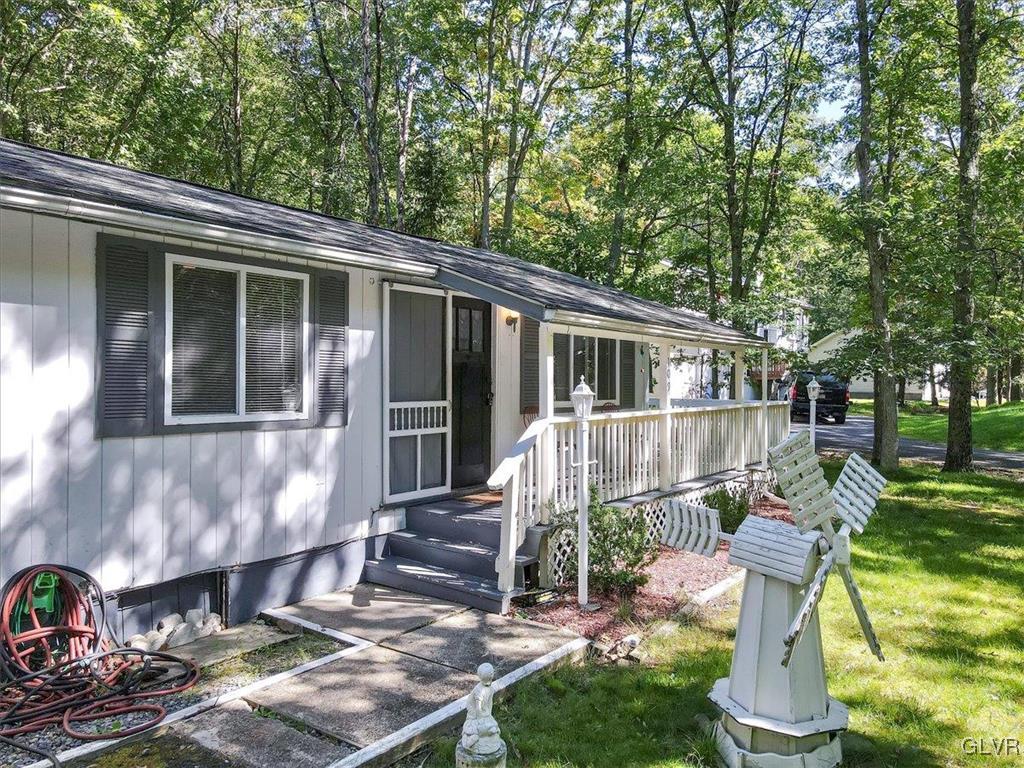 109 Sassafras Road Albrightsville, PA 18210 - Photo 5 of 49 a view of a house with backyard and sitting area