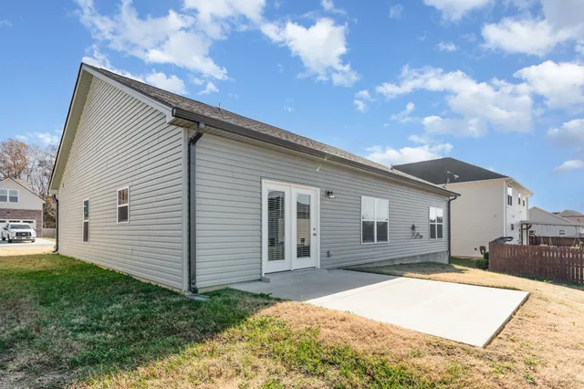 a house view with a backyard space